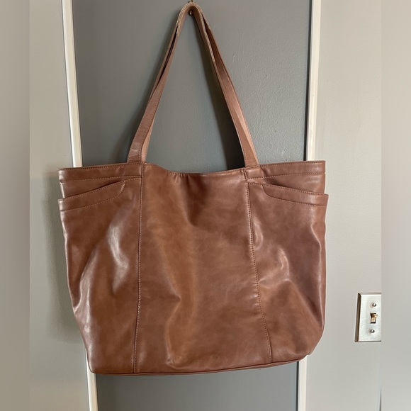 21x24x7 inches. Soft, buttery vegan leather. Beige with a hint of pink. - Picture 1 of 3